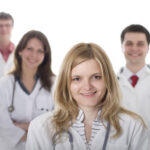 Smiling medical doctors with stethoscopes