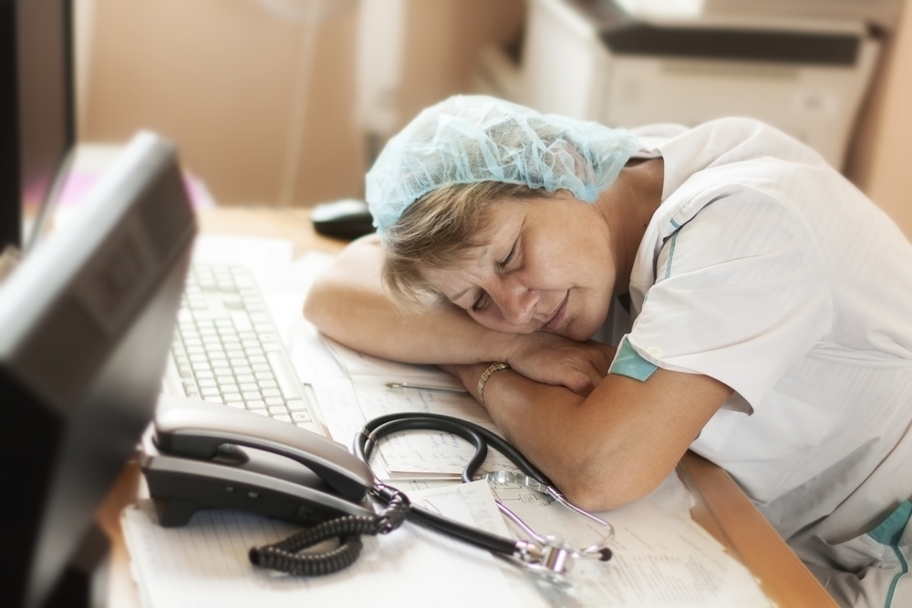 Medical worker sleeping on the job and smiles